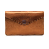 7 of 12:A metallic copper-brown leather envelope-style card holder with a snap button closure, shown against a plain white background.