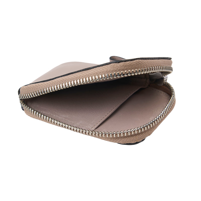 Brown leather pouch with zipper on a white background