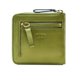 4 of 39:An olive green leather zip-around wallet by TUSK, featuring a front zip pocket with a gold-tone zipper, a matching leather pull tab, and a black wrist loop, shown on a plain white background.