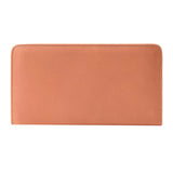 26 of 55:A peach-colored pebbled leather zip-around wallet shown flat against a solid white background.