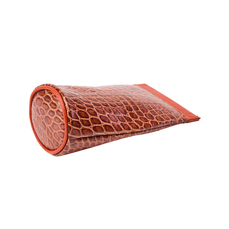 Brown crocodile-patterned eyeglass case on a white background