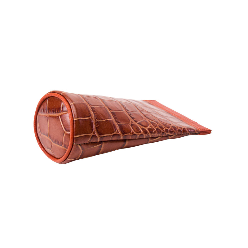 Brown crocodile-patterned eyeglasss case on a white background