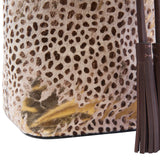 7 of 7:Close-up of a bag with a leopard print pattern and tassels.