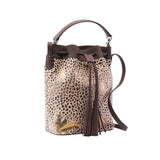 4 of 7:Leopard print bucket bag with brown leather accents on a white background