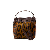9 of 29:Leopard print handbag with brown leather accents on a white background