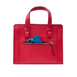 3 of 10:Red handbag with a blue phone in a pocket on a white background