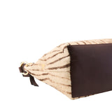 8 of 17:Hobo bag with zebra print  and brown bottom half on a white background