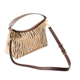 5 of 17:Handbag with zebra print pattern and brown strap on a white background