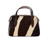 8 of 64:Handbag with zebra pattern on a white background