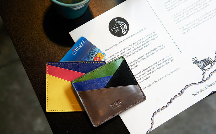 Image, A colorful wallet with cards on a brochure and table.