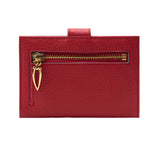 3 of 3:Red leather wallet with gold zipper on a white background