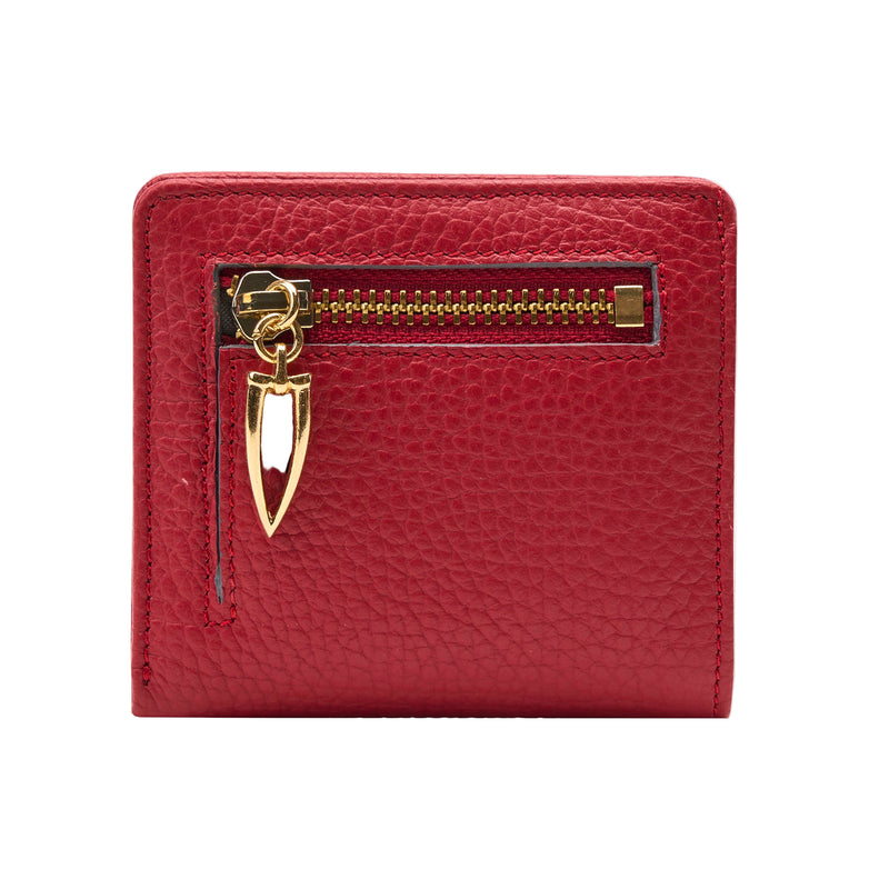 Red wallet with a gold zipper and decorative clasp on a light gray background